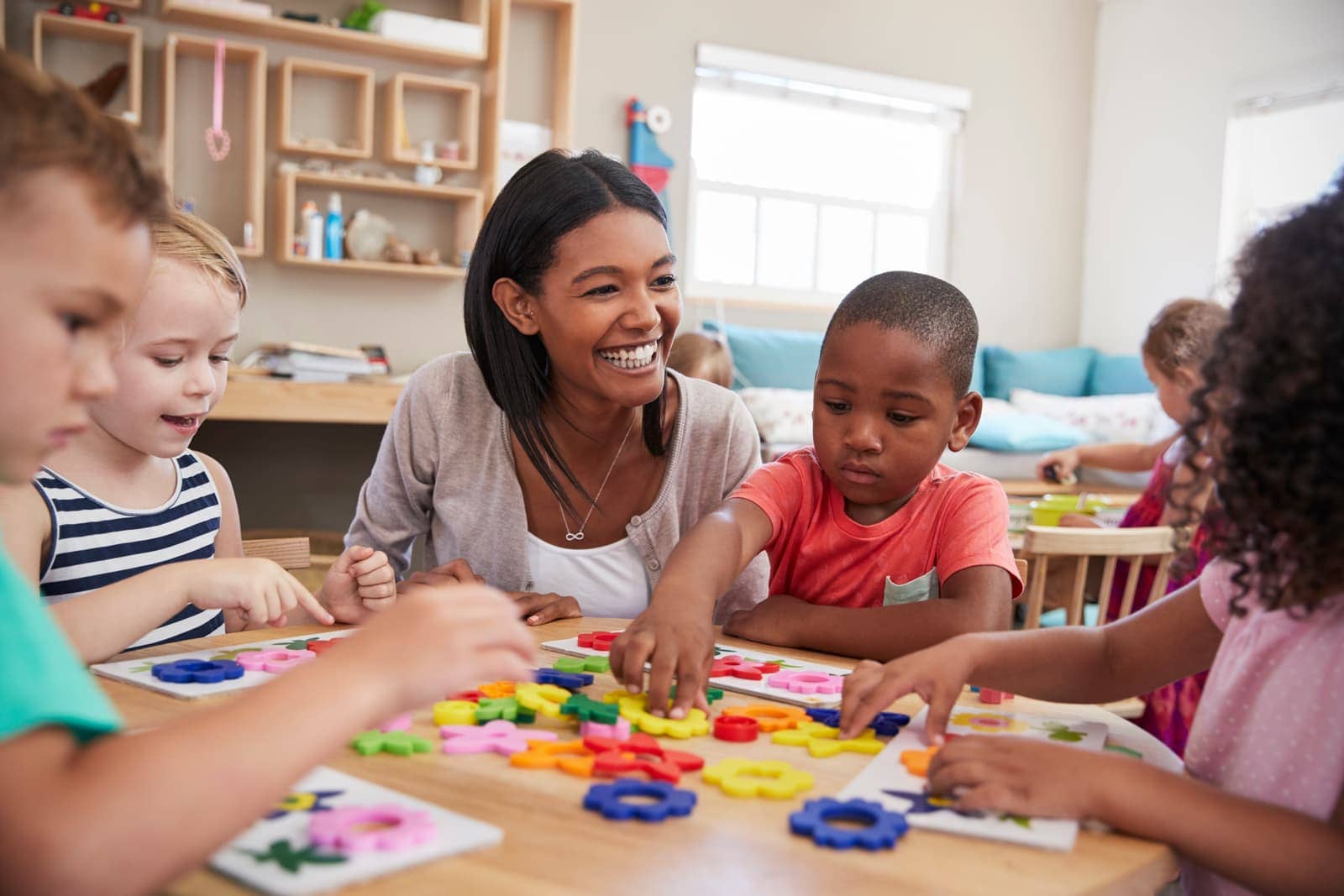 Educator and children learning together at Purple Plum